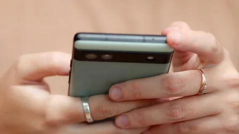 Close-up image of a woman's hand using a phone. concept of a modern communi.. 스톡 사진