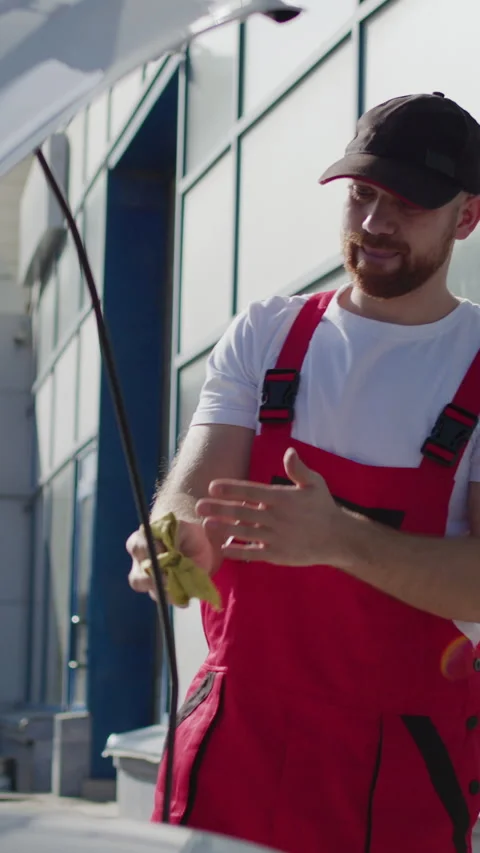 Close-up image of a worker from a car service checking the quality and quantity Stock Footage 276348383