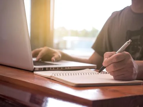 Close up image of young man using laptop technology Stock Photos