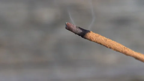 Close up of an Incense stick burning outside Stock Footage 131783724