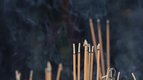 Close-up of incense sticks burning with smoke in buddhist temple , Vietnam Stock Footage 157246790