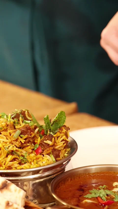 Close Up of Indian Biryani Rice and Curry in Restaurant Stock Footage 339411219
