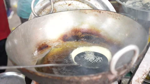 Close Up Of Indian Bread Puffing In Hot Oil In Traditional Kadai Video stock 341163819