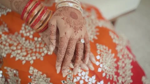 Close-up of Indian bride's hands covered with mehndi. Indian wedding ceremony. Stock Footage 261057550