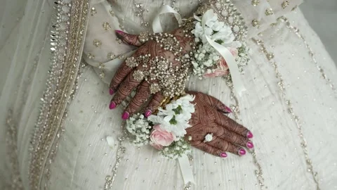 Close-up of Indian bride's hands covered with mehndi. Indian wedding ceremony. Stock Footage 284654699