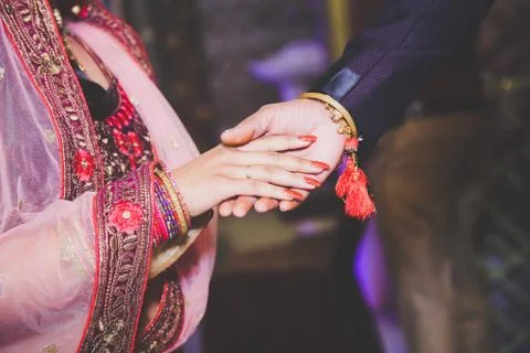 Close up of Indian couple's hands at a wedding Stock Photos