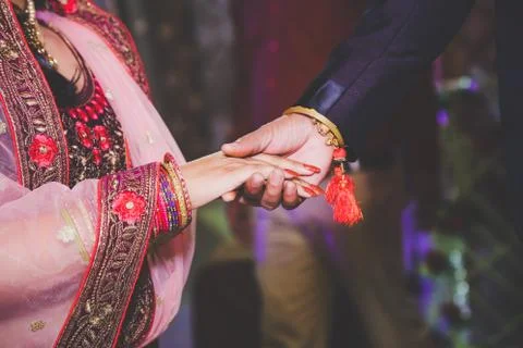 Close up of Indian couple's hands at a wedding Stock Photos