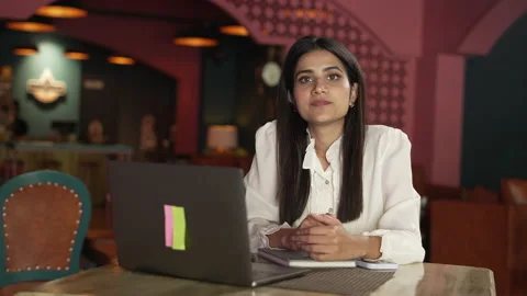 Close-up Indian female working  important email and typing on a laptop in cafe. Видео 232580960