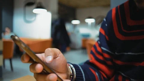 Close-Up, Indian Guy's Hand Scrolls Pages On The Internet On A Smartphone Stock Footage 101661415