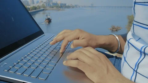 Close-up of Indian Student Hands Working on a Laptop on a Background Floating on Stock Footage 111155151