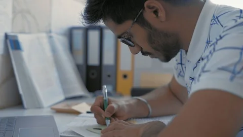 Close-up, Indian Student  Makes Sketching on Sticker, Prepares for Medecine Exam Stock Footage 107823477