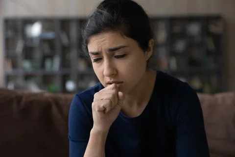 Close up Indian woman cough, feeling unhealthy, respiratory disease Stock Photos