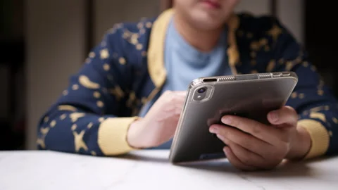 Close-up of an individual scribbling and writing some notes using a Stock Footage 268933820