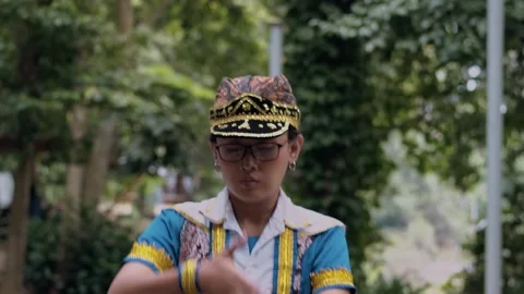 Close Up Indonesian Dancer Performing Hand Gestures and Scarf Dance Stock Footage 237545201