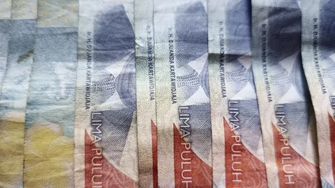 Close Up of Indonesian Rupiah Banknotes 50000 IDR Stock Footage 335970239