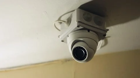 Close-up of an indoor dome security camera installed on the ceiling. The camera Stock Footage 304177503