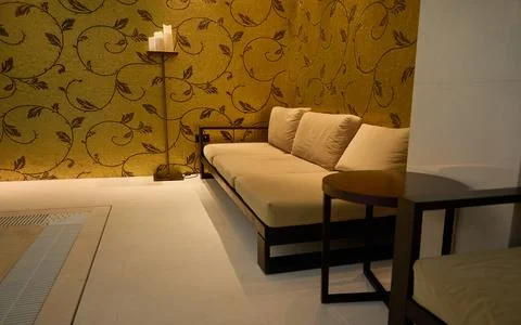 Close-up indoor interior. Comfortable sofa and wooden table in the lounge are Foto stock