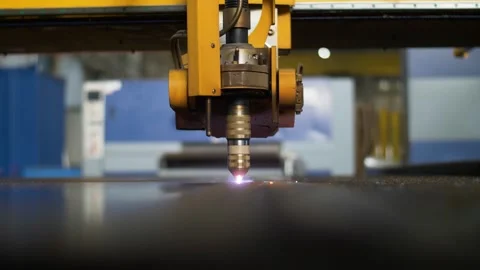 Close up of industrial CNC machine laser cutting steel in metal factory. Stock Footage 170942716
