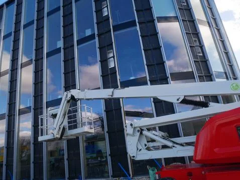 Close-up of an industrial construction cherry picker lift mechanism by a co.. Stock Photos