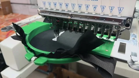 Close Up of Industrial Multi-Needle Embroidery Machine Head Stitching White.. 스톡 동영상 332204810