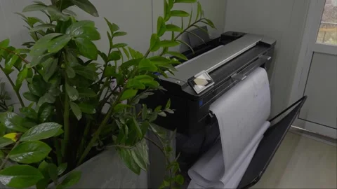 Close-up of an industrial printing machine processing perforated Stock Footage 332653692