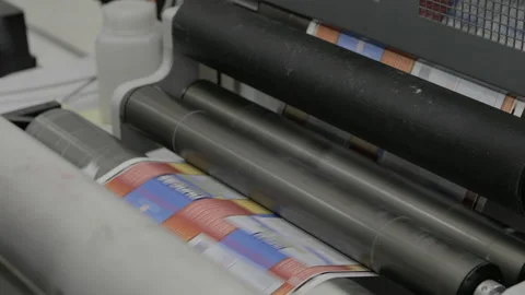 Close up of an industrial printing machine for self-adhesive labels Stock Footage 130755302