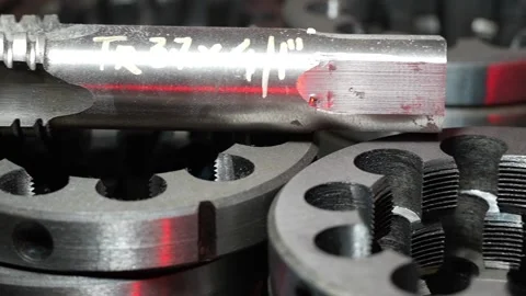 Close up of industrial threading dies and metal cutting tools in factory worksho Stock Footage 339808308