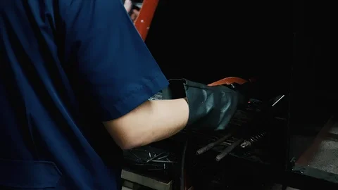 Close up of industrial worker scratching his stick electrode Stock Footage 102571870