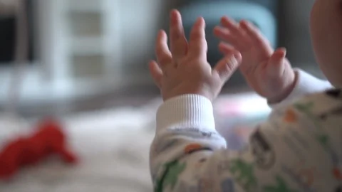 Close up of an infants hands clapping Stock Footage 104658916