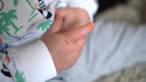Close up of an infants hands 動画素材 104658975