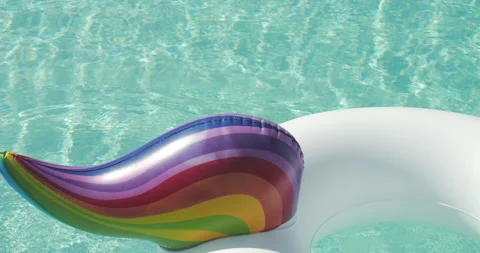 Close-up Inflatable Circle Unicorn Floats in Outdoor Infinity Swimming Pool on 動画素材 203906970