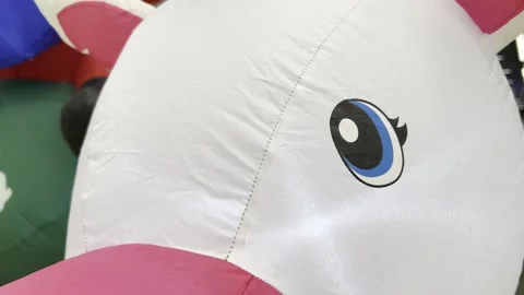 Close-up of inflatable unicorn decoration Stock Footage 291600455