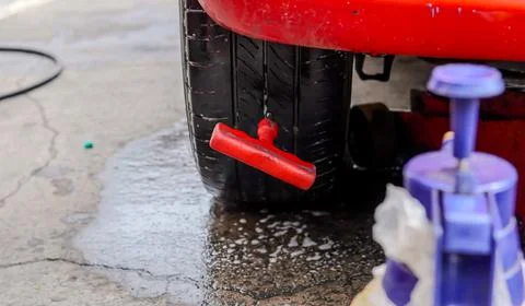 Close up inflating tire and checking air pressure with gauge pressure in se.. Stock Photos