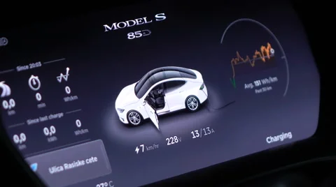 CLOSE UP: Information panel display in Tesla model S while charging battery Stock Footage 67308756