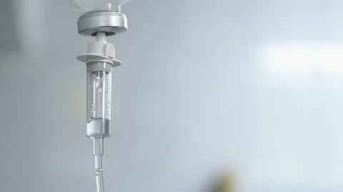 Close-up Infusion Process. Drop Saline is Dripped for IV During Chemotherapy. Stock Footage 160847386