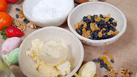 Close-up of ingredients for making Easter cake and decorated eggs on a canvas Stock Footage 153800146