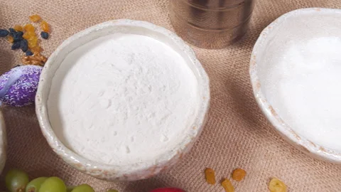 Close-up of ingredients for making Easter cake and decorated eggs on a canvas Stock Footage 174207544