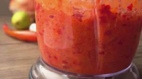 Close-up Ingredients for making hot chili sauce whipped in a blender Stock Footage 256427257