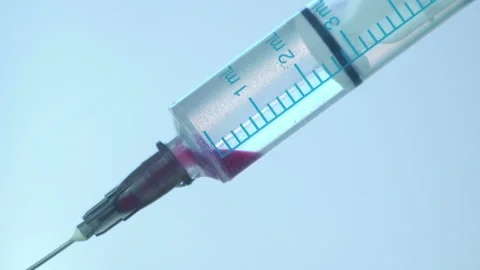 Close Up of Injection Liquid In Syringe Flu Shot Immunization Stock Footage 171249162