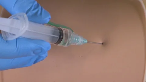 Close up of injection technique Stock Footage 125323807
