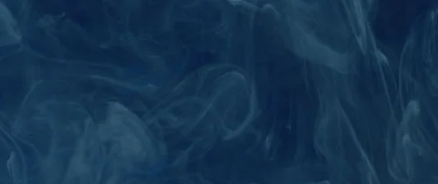 Close up of ink mixing in water glowing Stock Footage