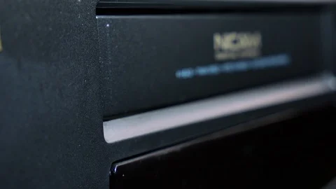 Close-up insert an analog VHS video cassette into the recorder VCR 4k Stock Footage 123456810