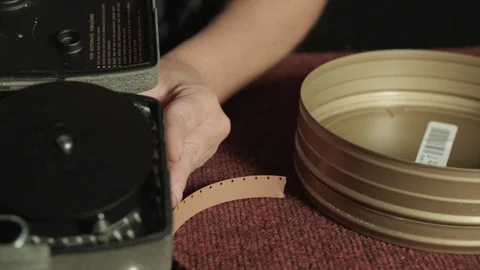 Close up inside 16mm motion picture film running through antique film camera Stock Footage 127245827