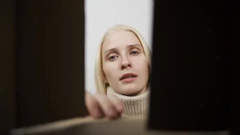 Close up inside of carton box bottom view, woman opens parcel looks at delivered Stock Footage 148201522