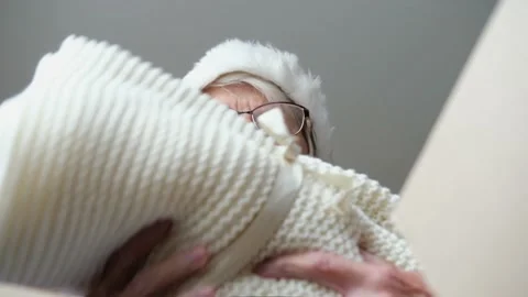 Close up inside of carton box bottom view, elderly woman wearing christmas hat Stock Footage 159593466