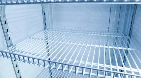 Close up inside an empty beverage cooler or display fridge with adjustable .. Stock Photos