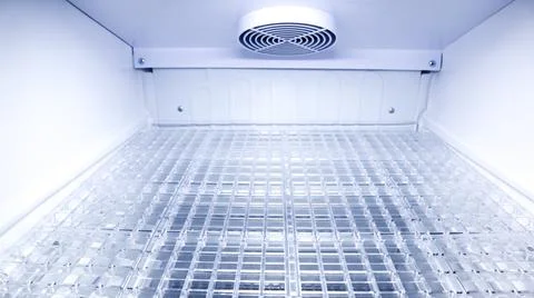 Close up inside an empty refrigerator or cooler compartment looking down at.. Stock Photos