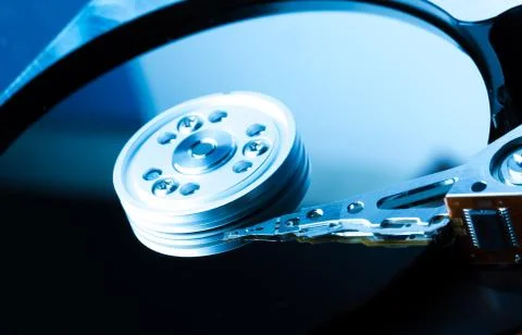 Close up inside of hard disk drive. Detail of writing/reading head on acuator Stock Photos