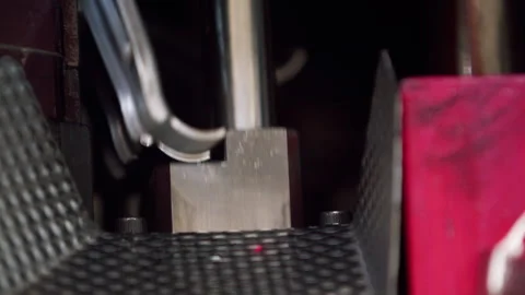 Close up of the inside of a hydraulic press shaping raw car parts in an Stock Footage 255216113