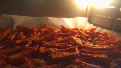 Close Up Inside Oven During Sweet Potato Baking Stock Footage 334621604